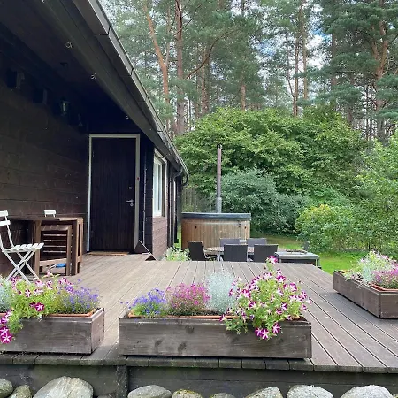 Vakantiehuis Cozy Loghouse With Sauna Near A Great Sandy Syytme